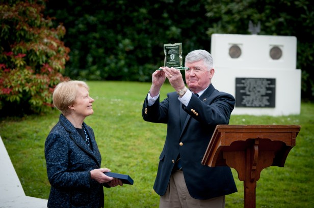 Col Dave Wall USMC Retd, inspects the 2015 Paddy Hone Award presented by Mrs Pat Hume to Col Wall on behalf of Military Historical Tours of Woodbridge, VA. Mrs Hume is a Patron of the Beech Hill US Navy & Marine Corps Association which annually presents an award to an individual or organisation which has made a significant contribution to preserving the story the US Navy and Marine Corps in Derry during the Second World War. Military Historical Tours are working with the Base One Museum at the Beech Hill and with Tourism Ireland to develop an annual visit to Derry to look at the history of the WWII US Naval Base. PHOTOCREDIT Stephen Latimer